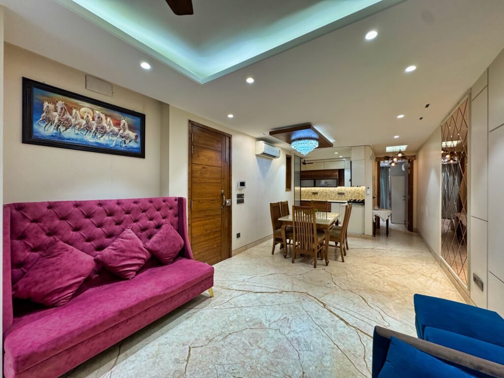 Why do corporate travelers prefer service apartments in Delhi?